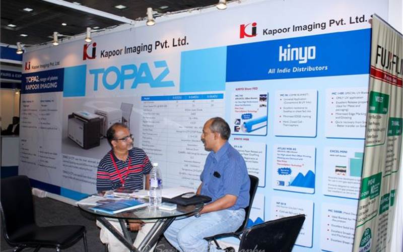 Kapoor Imaging announced several strategic plans for the company, starting with the soft launch of their own branded Topaz CTP. Girdhidaran K, CEO (r) with a customer