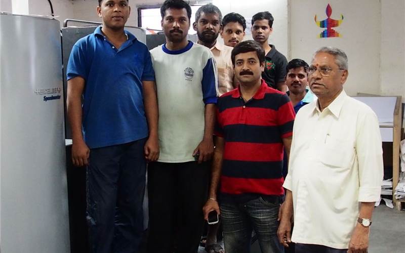 The production team along with Sopan (r), a shopfloor veteran and Lalit Naik, operations manager
