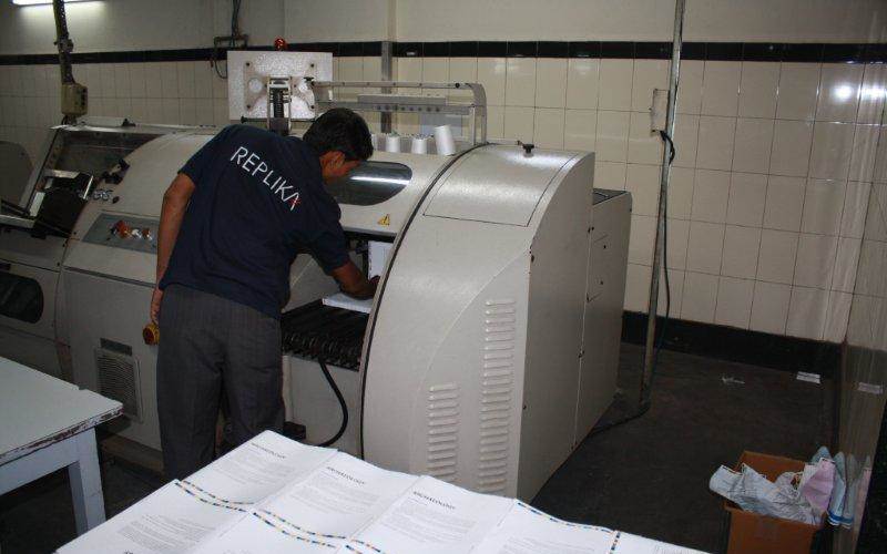 Section-sewing operator puts the sections of sheets into the machine