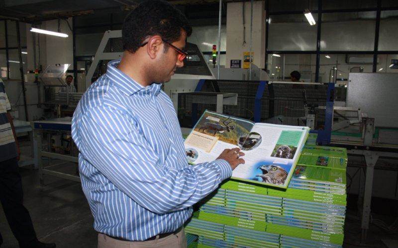 Sanandan Seth, director marketing, Replika Press, personally, checks the finishing of the book