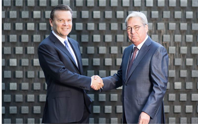 (l) Peter R Huntsman, president and CEO of Huntsman with Hariolf Kottmann, CEO of Clariant