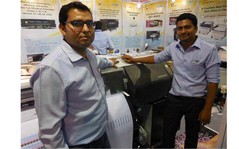 (l-r) Ajit Singh Rajput and Nikesh Patel of Arrow Digital. The company displayed Color Printer M-64s, banner printer and wide-format eco-solvent printer