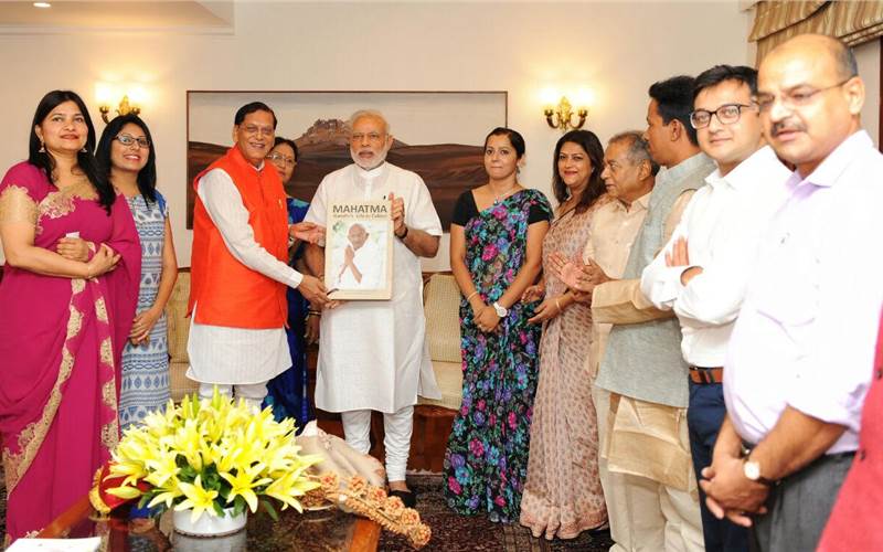 The first copy of the book presented to the Prime Minister