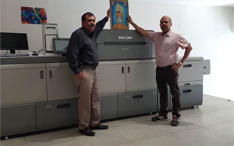 (from left) Pankaj Ahuja and Mukesh Tanwani of Tituprint with the Ricoh Pro C9100